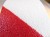 taśma antypoślizgowa biało-czerwona pasy ostrzegawcza samoprzylepna HANSA TAPES zbliżenie MACRO